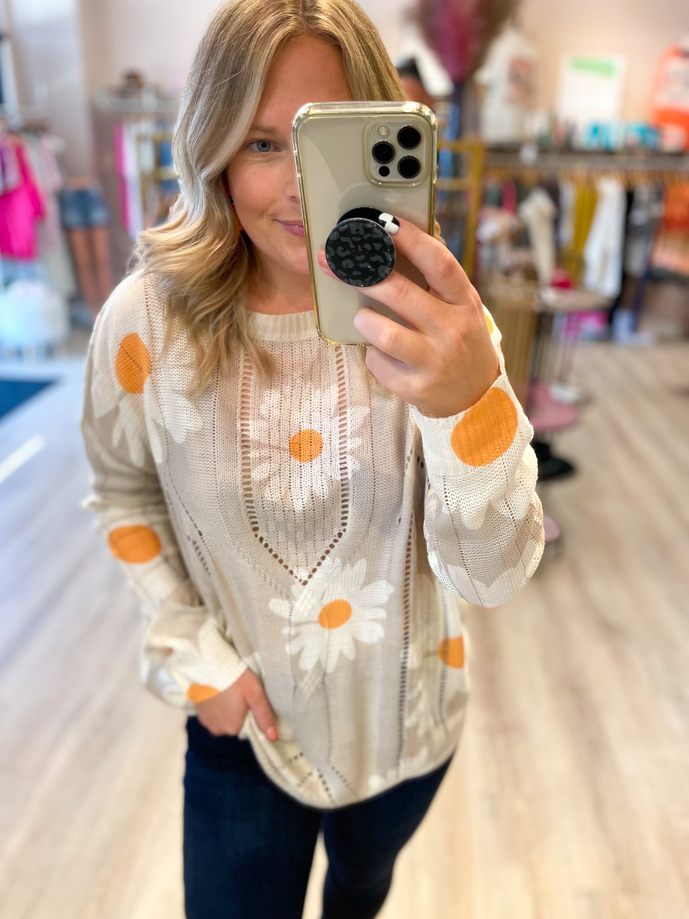 cream open knit sweater with daisies